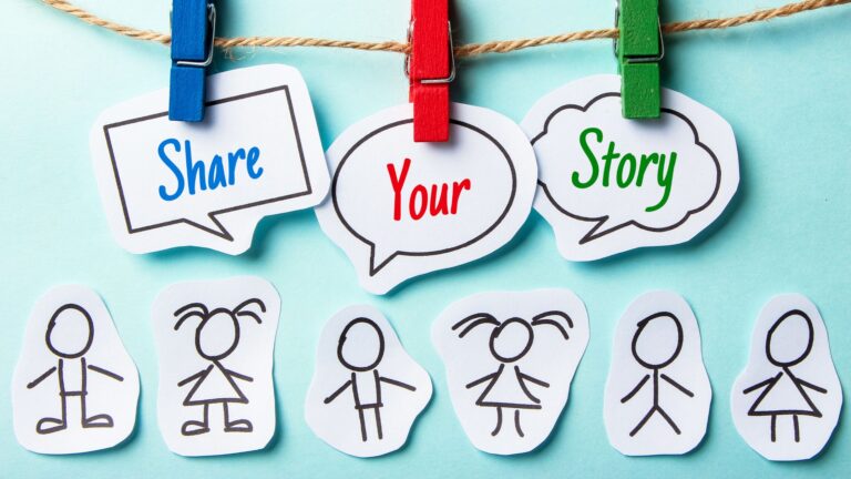 Display of a social story: Paper cutouts representing people with title "share your story"