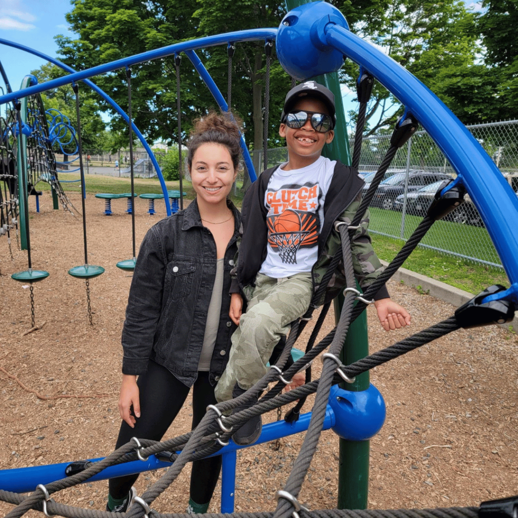 Therapist and student at playground