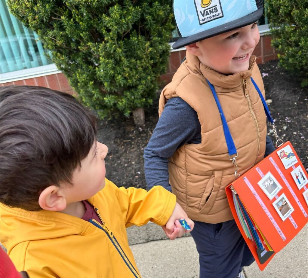 RCS Consulting Early Childhood Center students walking holding hands